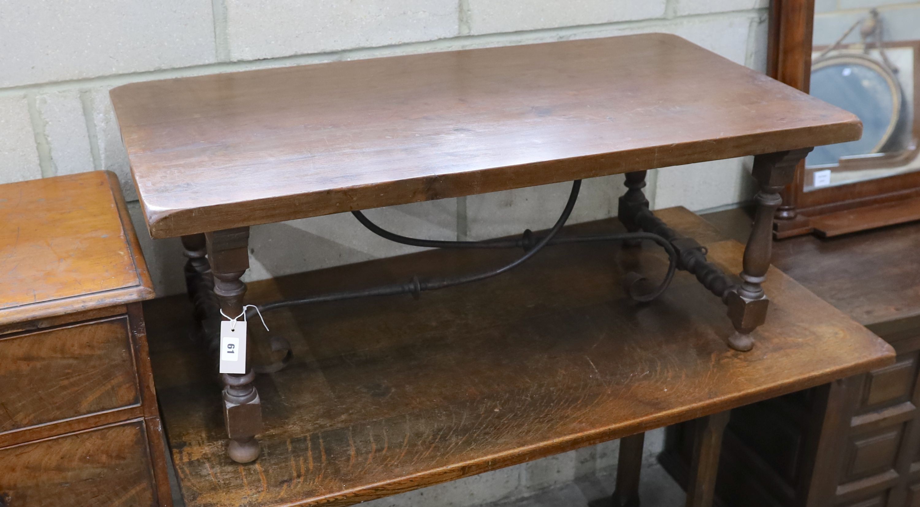 A Spanish style rectangular fruitwood low table, with wrought iron stretcher, length 107cm, depth 57cm, height 43cm